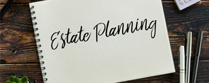 Notebook with the words Estate Planning written on it