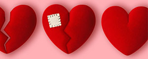 Three red felt hearts with a pink background. One is broken, one has a patch, and one is whole. 