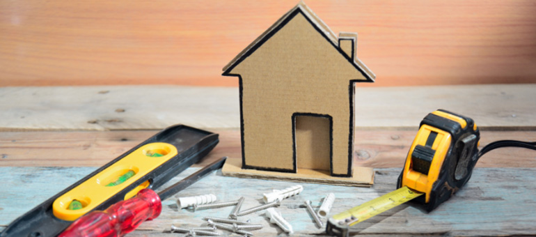 Tiny house with tape measure and level