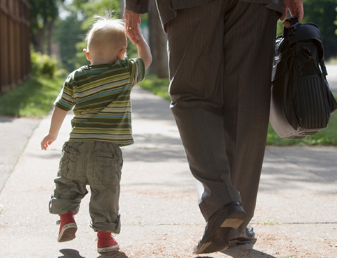 Man holding child's hand