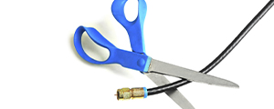 scissors cutting cable tv cord