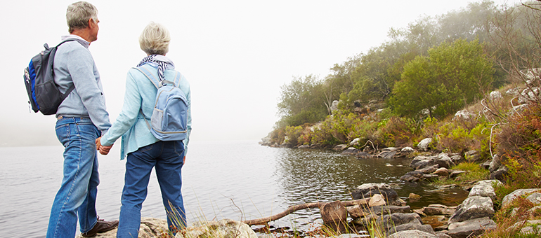 couple hiking near water