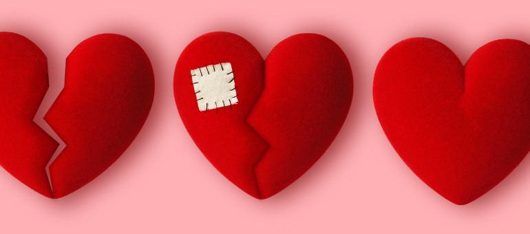 Three red felt hearts with a pink background. One is broken, one has a patch, and one is whole. 