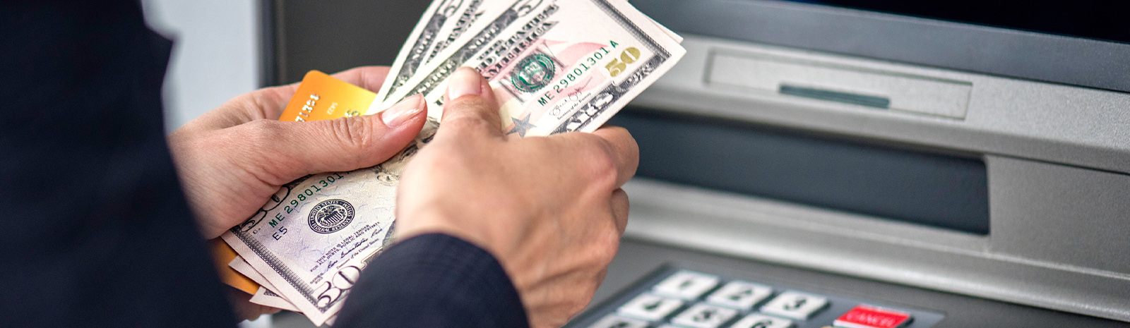 Person getting money from ATM