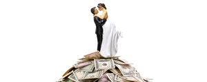 Bride and Groom figurine on top of money pile