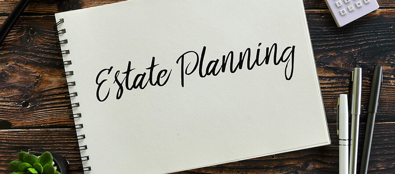 Notebook with the words Estate Planning written on it